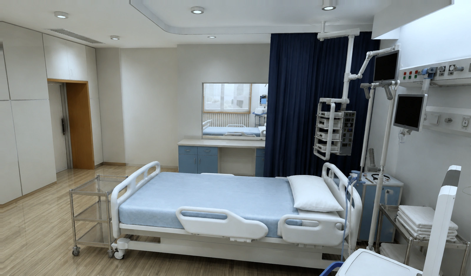 An empty hospital ward bay: bed made up beside a privacy curtain, a ceiling-mounted monitor arm and a wall rail of medical outlets